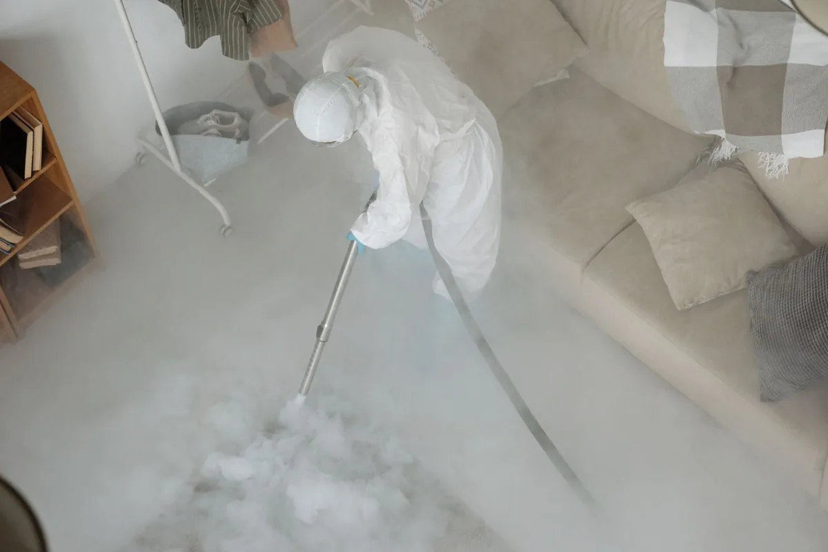 Biohazard cleanup technician in protective equipment, Lebanon, OR